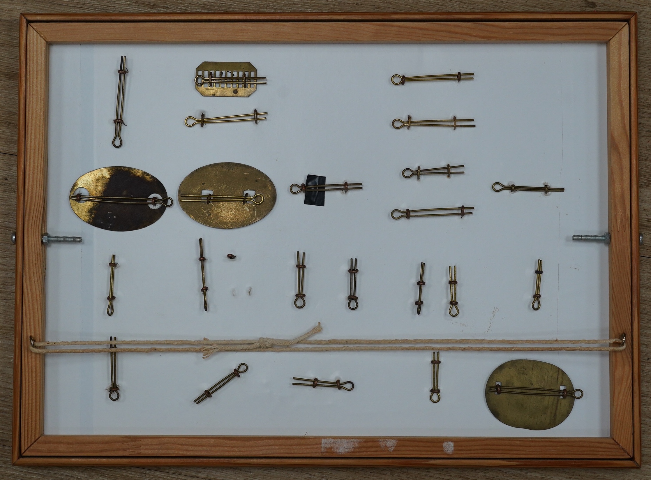 A collection of fifty-eight military cap badges, plus a few shoulder titles, mounted on four boards including; 26th Hussars, Inniskilling Regiment, 3rd Dragoon Guards, the Cheshire Regiment, Loyal North Lancashire, the N